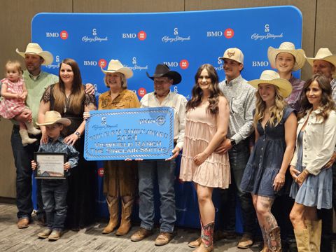 Stuart and Ruby Sinclair- Smith family receiving the BMO Farm Family Award at the Calgary Stampede